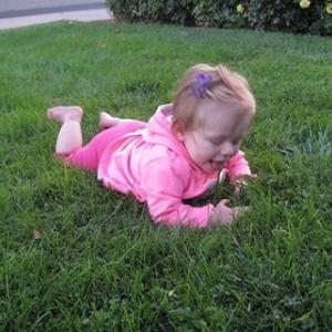 Granddaughter discovering the wonders of grass Granddaughter discovering the wonders of grass