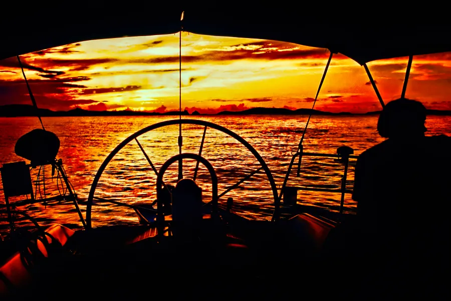 Sailing in the islands at sunset Sailing in the islands at sunset