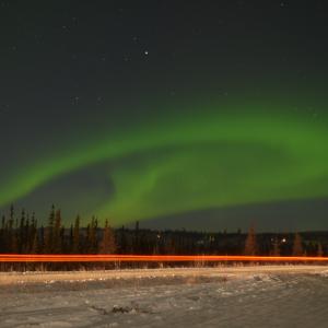 Zipping by the Aurora Sky
