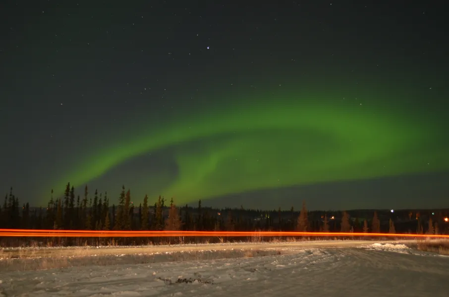 Zipping by the Aurora Sky