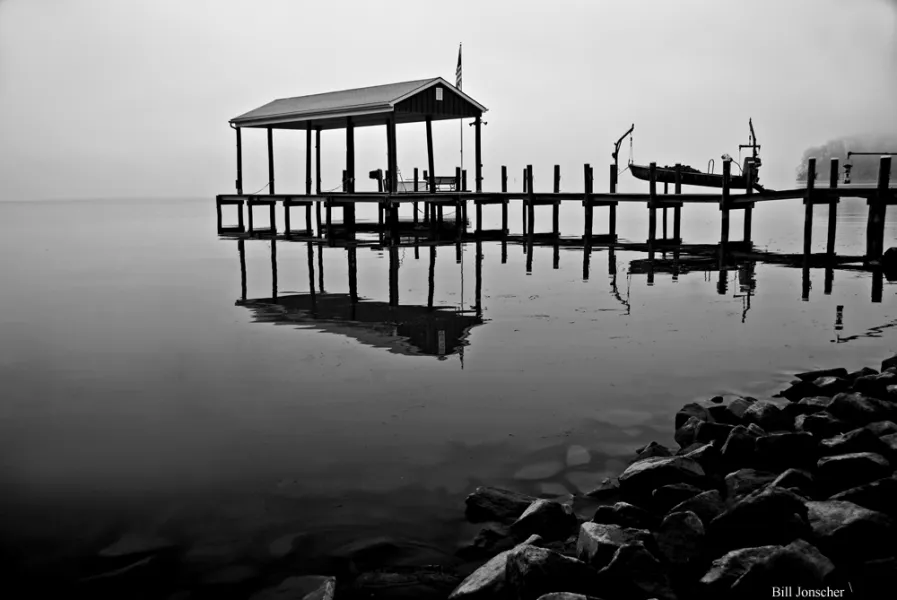 Boat house in the fog