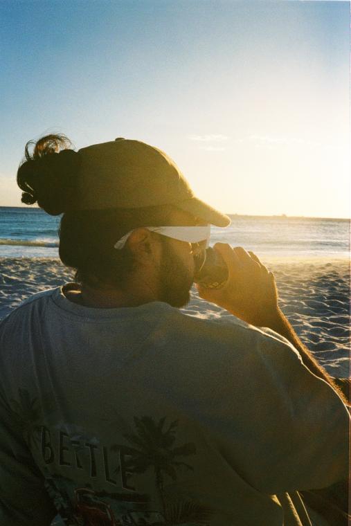The boy, the beach, the beer ☀️