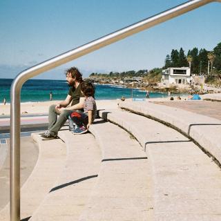 Dad and son, enjoying the sun